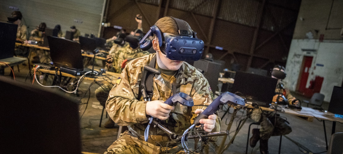 Soldier using VR headset and controllers
