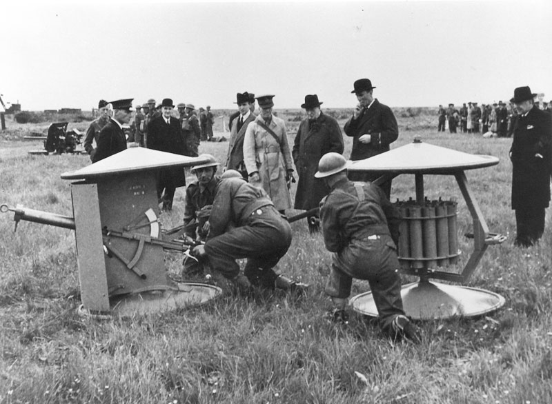 Equipment Demonstration held on 13 June 1941. L-R: Professor Lindemann (bowler hat), Archibald Sinclair (Secretary of State for Air), Field Marshal Sir John Dill (CIGS), Captain D Margesson (Secretary of State for War), Lord Beaverbrook