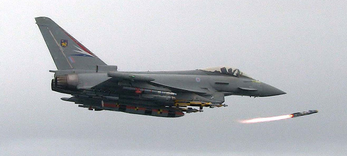 Eurofighter Typhoon in flight releasing air to air missile