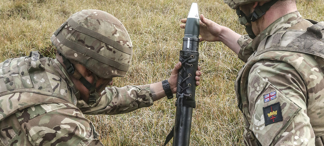 Mortar disposal blog image showing two soldiers operating a mortar