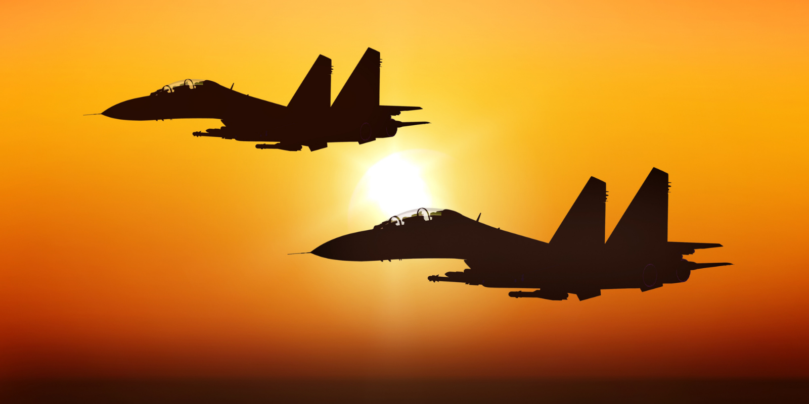 AI fighter - two fighter jets in silhouette flying alongside each other with sun in background