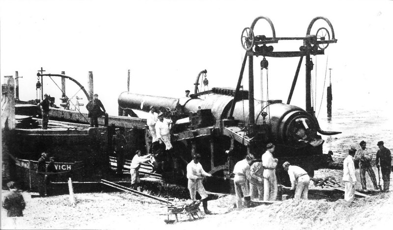 An Armstrong 16.25in 110 ton Breech Loading Gun being off-loaded from the War Department Barge 'Gog' in c1888. The Railway Proof Sleigh weighed 95 tons (Navy & Army Illustrated)