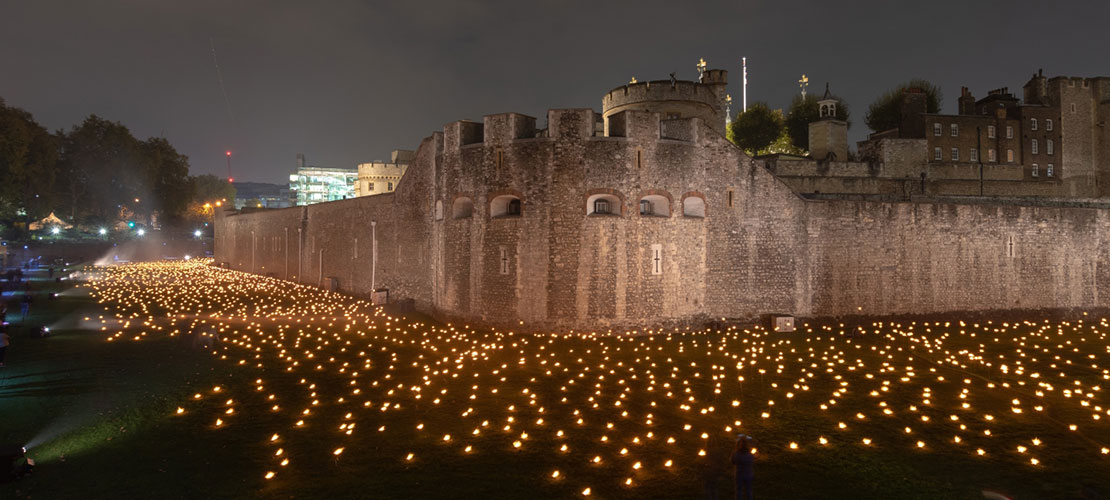 Tower of London 2018 showing nightly candles lit beyond the deepening shadow