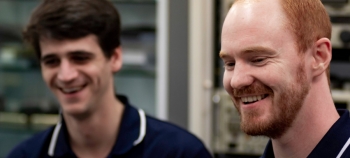 Two QinetiQ Australia employees smiling