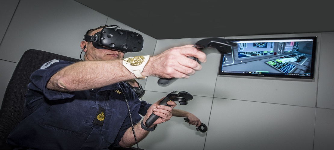 virtual reality console being used by operator for training using headset and hand controllers