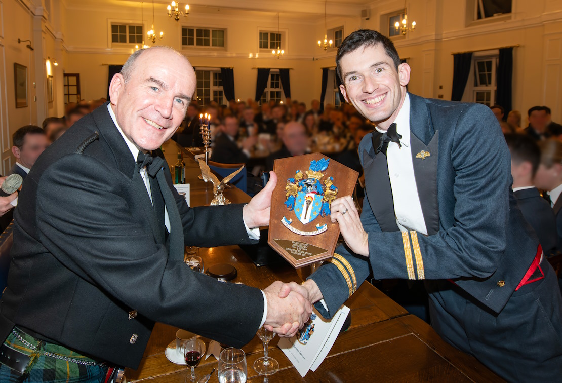 Flt Lt McNamara of the Royal Air Force being presented with the McKenna trophy.