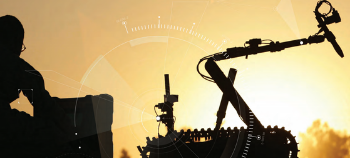 Human Machine Teaming - showing human operator and tracked robot in silhouette with sun in background