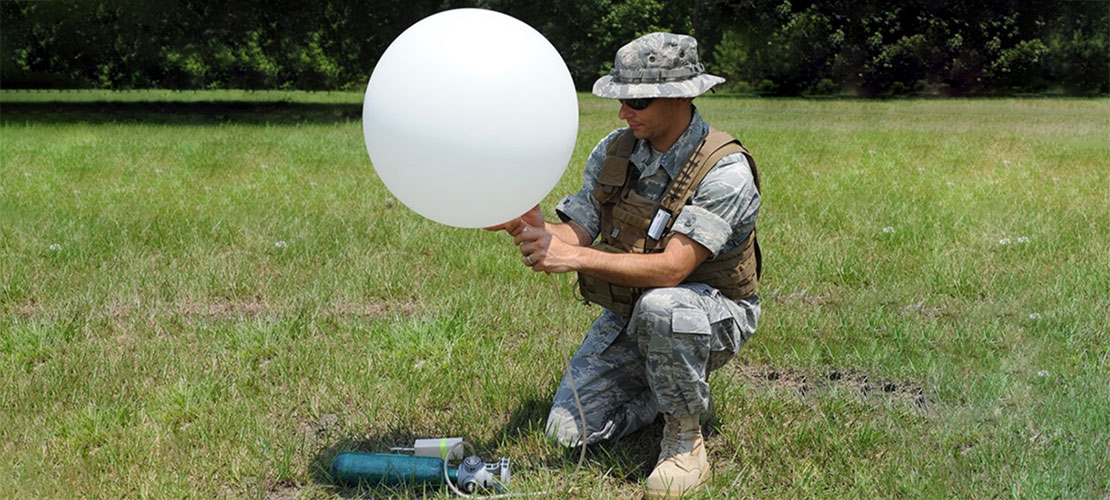 Man demonstrating Tactical Atmospheric Sounding Kit (TASK) system