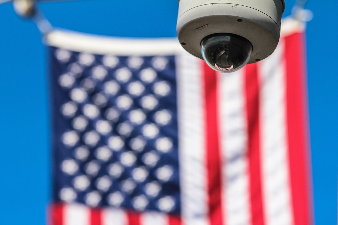 Image of the US flag and a security camera - Department of Homeland Security Image